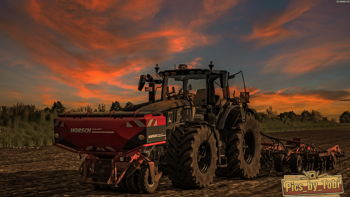 Drillen im Sonnenuntergang mit einen John  Derre 6R250